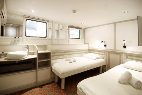 Postel nebo postele na pokoji v ubytování Kapitein Anna