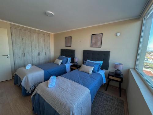 Ένα ή περισσότερα κρεβάτια σε δωμάτιο στο Dpto por dia Chillán 909