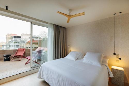 Giường trong phòng chung tại Hotel Taro Santa Cruz