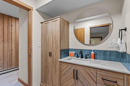 a bathroom with a sink and a mirror at Bend Mt Bachelor Village Condo! in Bend