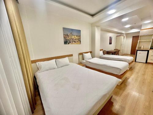 En eller flere senge i et værelse på Valence Boutique Hotel Istanbul Taksim