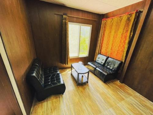 Et opholdsområde på Malam Jabba Cottages