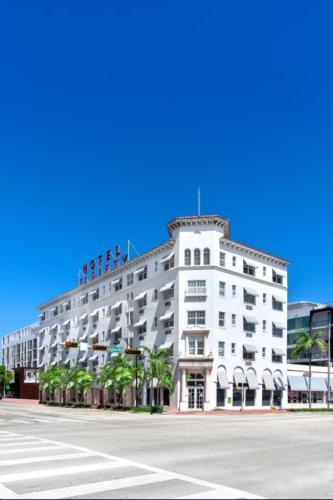 a large white building with people on top of it at Bluebird Suites at The Apex Miami in Miami Beach
