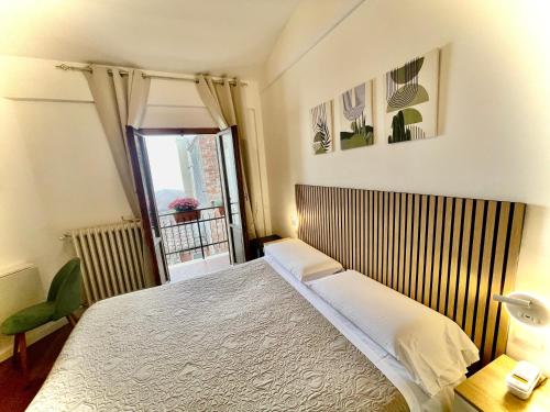 Ένα ή περισσότερα κρεβάτια σε δωμάτιο στο Hotel S. Ercolano