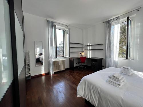 Ένα ή περισσότερα κρεβάτια σε δωμάτιο στο Kibilu - Via Ciro Menotti