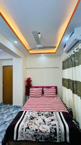 a bedroom with a large bed in a room at Hotel Prime City Residential in Dhaka