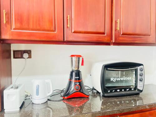 Η κουζίνα ή μικρή κουζίνα στο Amity Villa