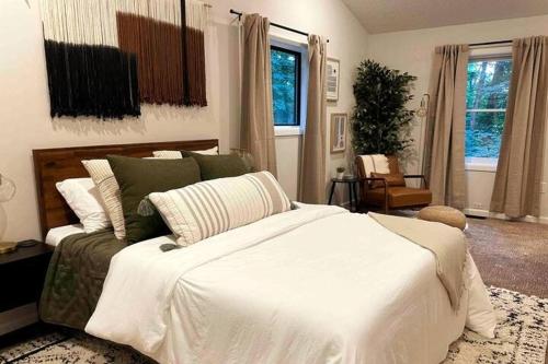 a bedroom with a large bed and a couch at Apple Mountain Retreat at Shenandoah National Park 