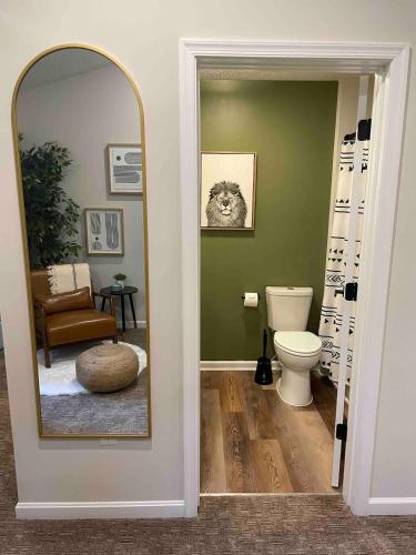 a bathroom with a mirror and a toilet at Apple Mountain Retreat at Shenandoah National Park 