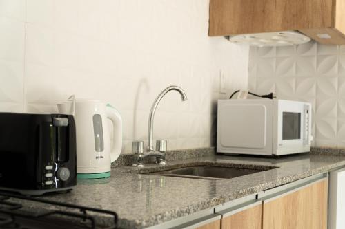 Kuchyň nebo kuchyňský kout v ubytování Grin Apartments