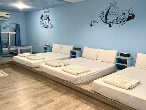 Postel nebo postele na pokoji v ubytování Xiao Liuqiu 539 民宿