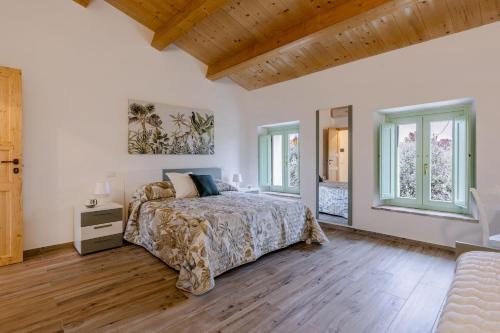 En eller flere senge i et værelse på Italian Experience-Zena Apartment