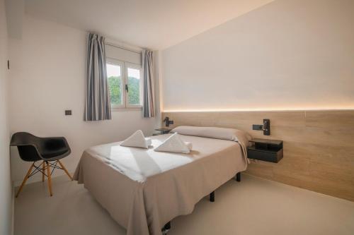 Ένα ή περισσότερα κρεβάτια σε δωμάτιο στο Aparthotel Marsol