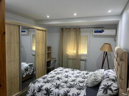 En eller flere senge i et værelse på Apartment F2 a Sidi Mabrouk