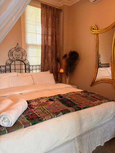 Giường trong phòng chung tại Caye Caulker Boutique Guesthouse 3