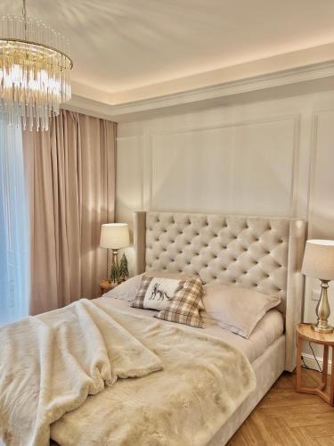 En eller flere senge i et værelse på Mia Baltic apartament Greeneri Park