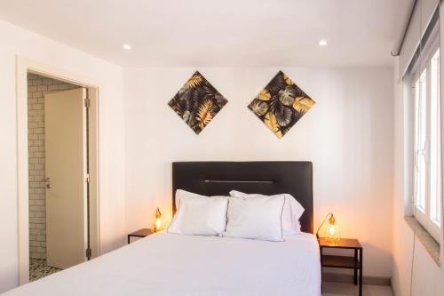 Postel nebo postele na pokoji v ubytování Alto da Lapa House w Parking by LovelyStay