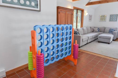 a living room with a giant eight ball game at 15 Min Walk to Beach w Kayaks in Wellfleet