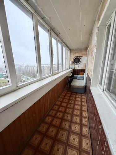 an empty room with windows in a building at Apartmány Cestovatele in Jáma František