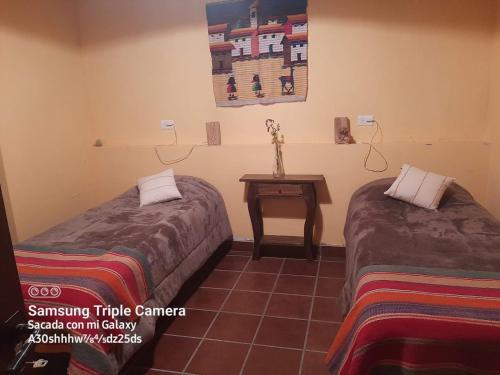 Postel nebo postele na pokoji v ubytování Ñawpa Wasi