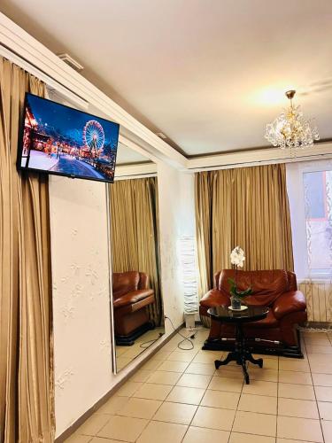 TV a/nebo společenská místnost v ubytování Center Studiopi
