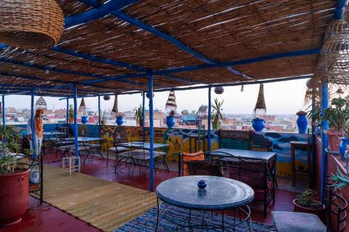 a view from a restaurant with tables and chairs at Dar Merzouga Meknes in Meknès