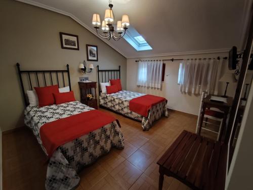 En eller flere senge i et værelse på Hostal Juan