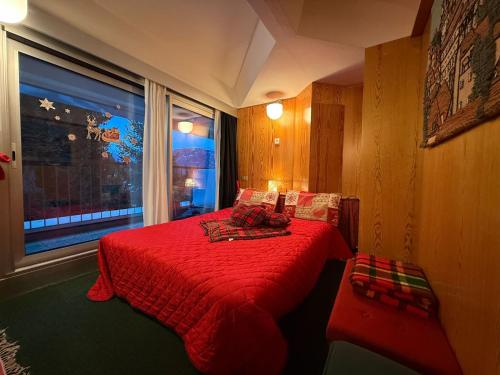 Ένα ή περισσότερα κρεβάτια σε δωμάτιο στο Appartamento Cinzia Residence Solaria Marilleva 1400