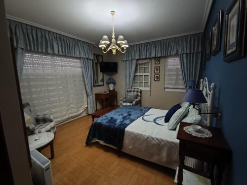 En eller flere senge i et værelse på Hostal Juan