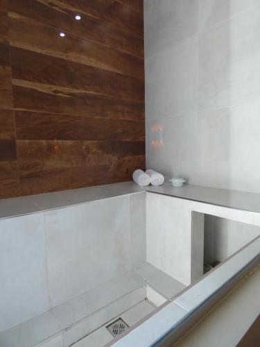 a bathroom with a counter with two towels at OSHO Hotel in Santa Cruz de la Sierra