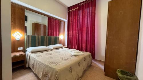 a bedroom with a bed with two towels on it at moonstar guesthouse termini in Rome