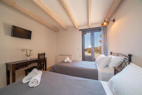 Ένα ή περισσότερα κρεβάτια σε δωμάτιο στο Villa Ostria