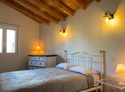 Ένα ή περισσότερα κρεβάτια σε δωμάτιο στο Casinha do Palheiro T1-Casinhas de Trás das Eiras