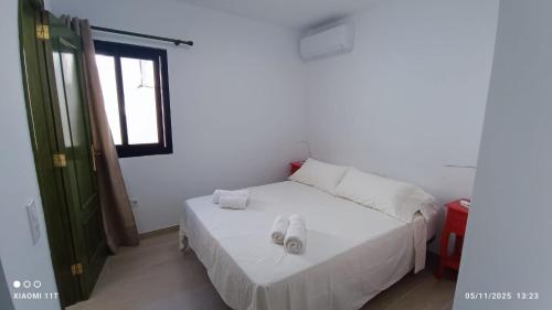 Giường trong phòng chung tại ÁTICO EN PRIMERA LINEA DE PLAYA