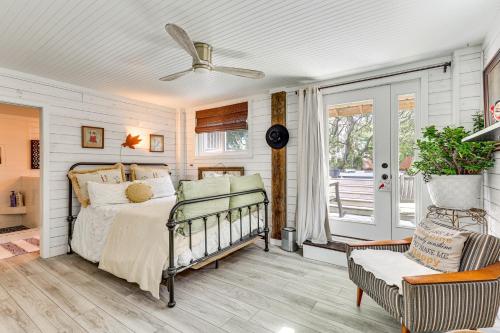 a bedroom with a bed and a ceiling fan at Steps to Sand! Topsail Beach Group Getaway! in Surf City