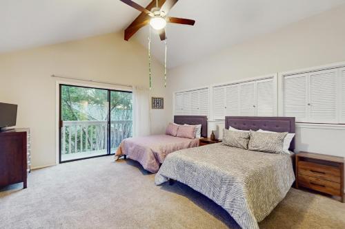 a bedroom with two beds and a ceiling fan at Horseshoe Bay Getaway in Horseshoe Bay