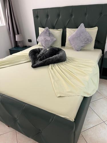 a bed with two pillows on top of it at Rosa dei venti 3 in Santa Maria
