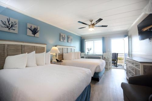 Giường trong phòng chung tại Marquis De Lafayette