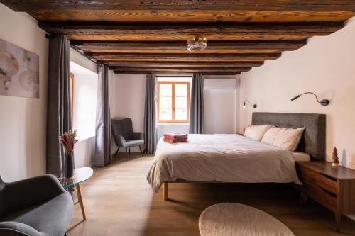 En eller flere senge i et værelse på Les 4 Fontaines