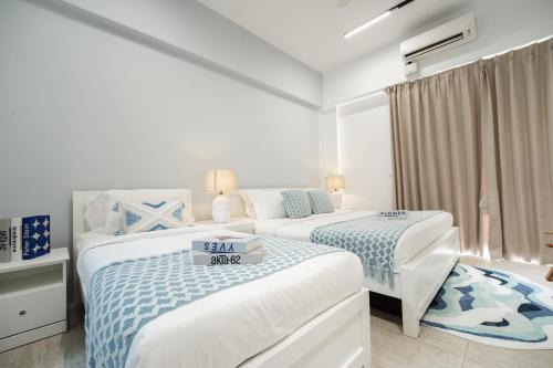 Кровать или кровати в номере By The Sea Haven 2BR 6pax