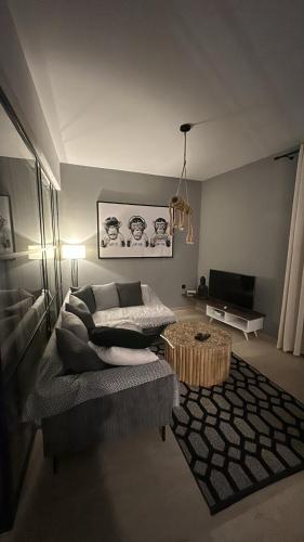 a living room with a couch and a coffee table at Mimis Skyline in Xanthi