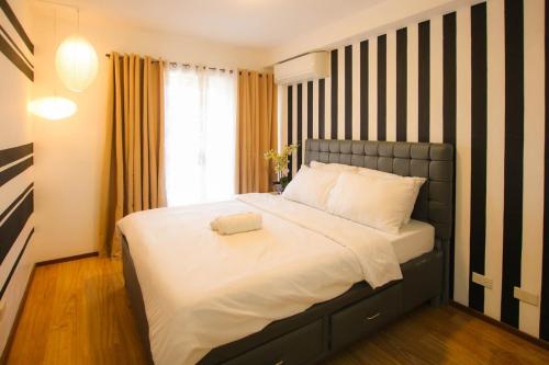 Фотография из галереи Casa - The Calm Coastal Two-Bedroom Suite Near SM Seaside Mall and Nustar Casino в Себу