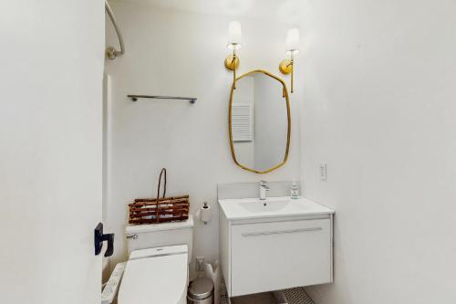 a bathroom with a sink and a mirror at The Woods Village 1 in Killington
