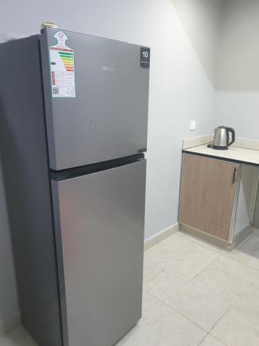 Kuchyň nebo kuchyňský kout v ubytování Al Buraq Economic Apartments