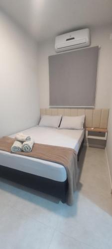 Llit o llits en una habitació de Loft aconchegante