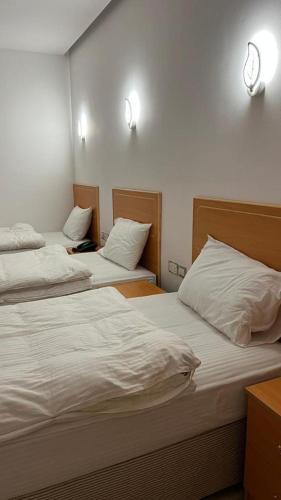 Llit o llits en una habitació de فندق صلالة