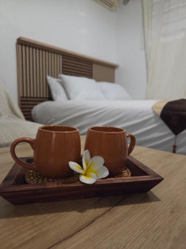 Postel nebo postele na pokoji v ubytování Sawadee Studio, meublé & jardin