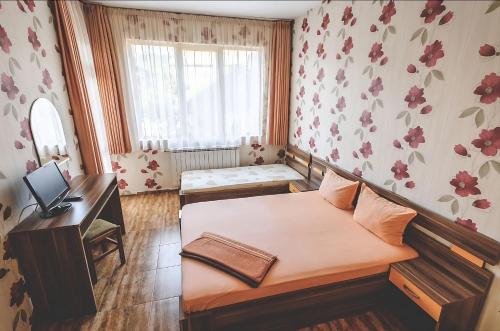 Кровать или кровати в номере Къща за гости Бумеранг