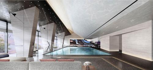 a swimming pool in a room with a ceiling at Crowne Plaza Linyi Olympic Sports Centre by IHG in Linyi