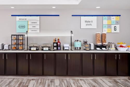 a kitchen with a counter with some food on it at Garner Hotel Mahwah by IHG in Mahwah